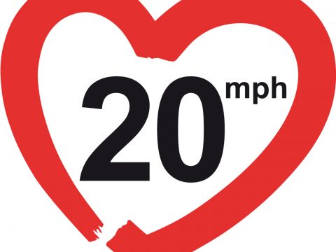 red heart shape with 20 mph written inide - dsigned to resemble speed limit sign